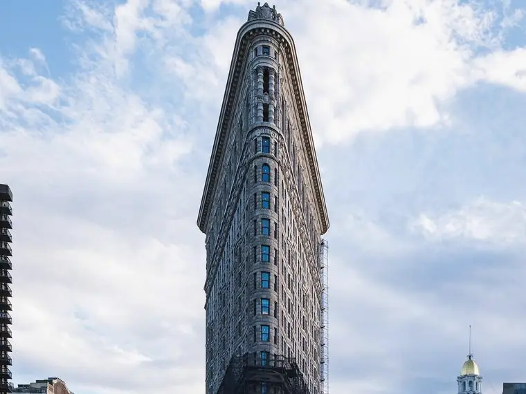 The Flatiron Building rising over Fifth Avenue and Broadway