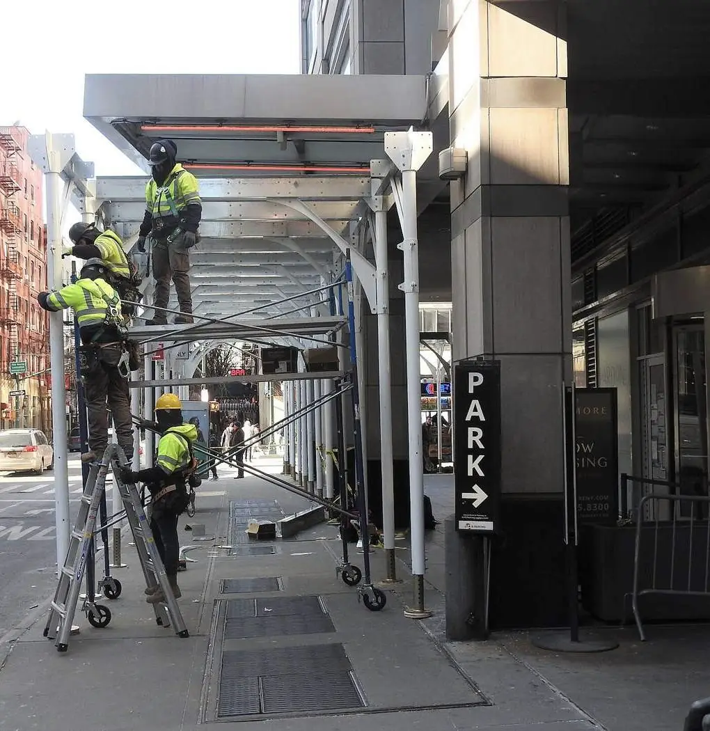 A sidewalk shed over a Manhattan sidewalk on West 47th Street