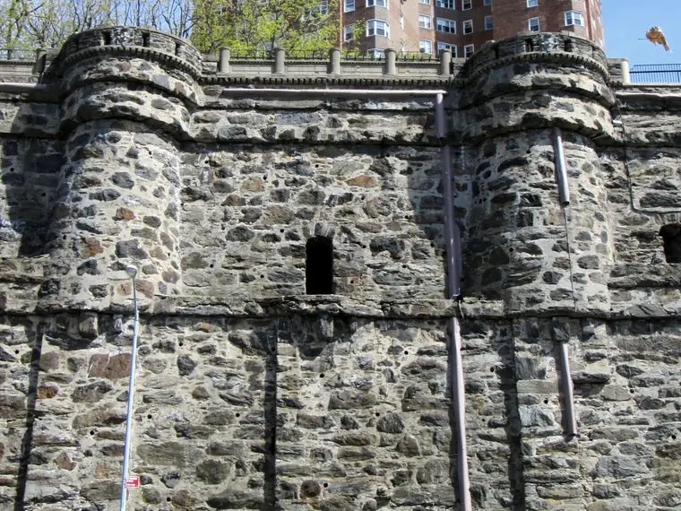 Old stone retaining wall below an apartment complex in Washington Heights, Manhattan