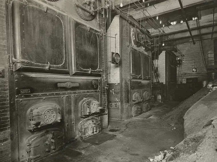 Old coal-fired boilers in a Brooklyn factory boiler room